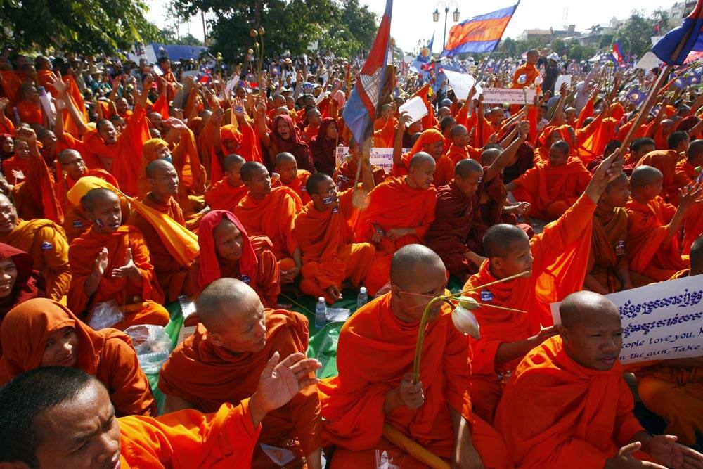 Cambodian Buddhist monks participate in a demonstration in Phnom Penh. More than 10,000 opposition supporters have gathered in Cambodia`s capital to repeat their demand for an investigation into alleged election irregularities, a day before the results of the poll six weeks ago are to be ratified.