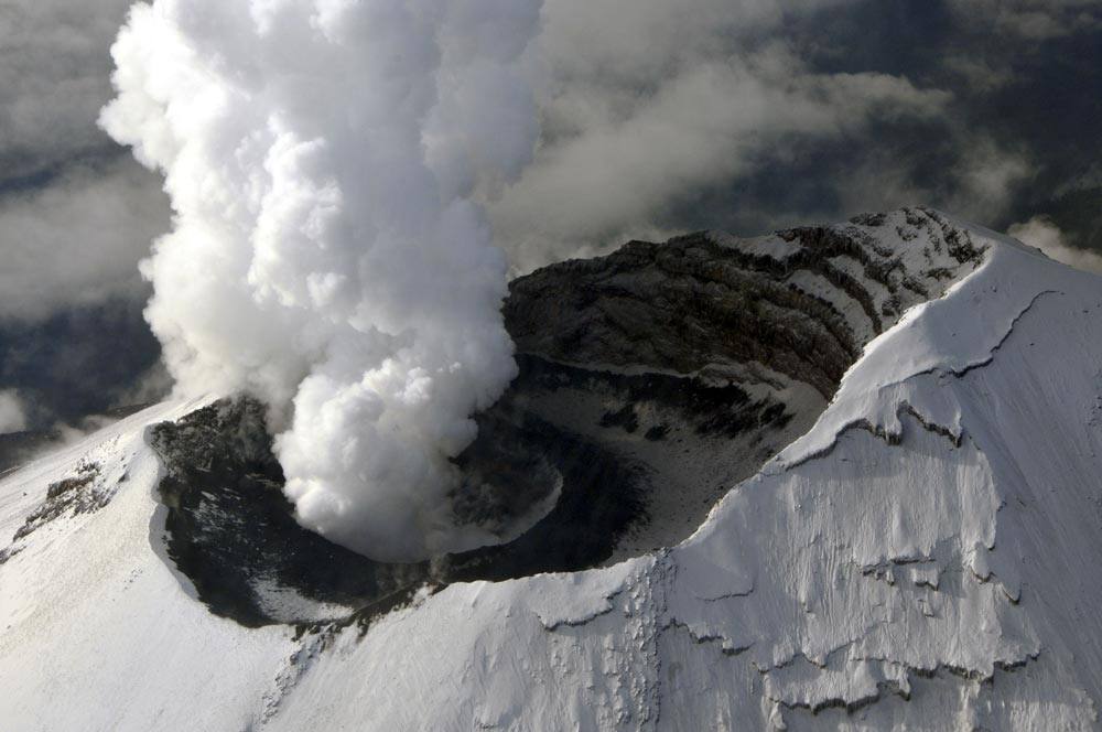 This image released by the Mexican Navy (SEMAR), steam and ash rise from the crater of the Popocatepetl volcano on the outskirts of Mexico City, seen during an over flight.