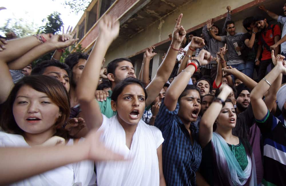Students shout slogans and protest against the alleged rape of five mentally ill girls staying at a home run by a non-governmental organization in Jammu.