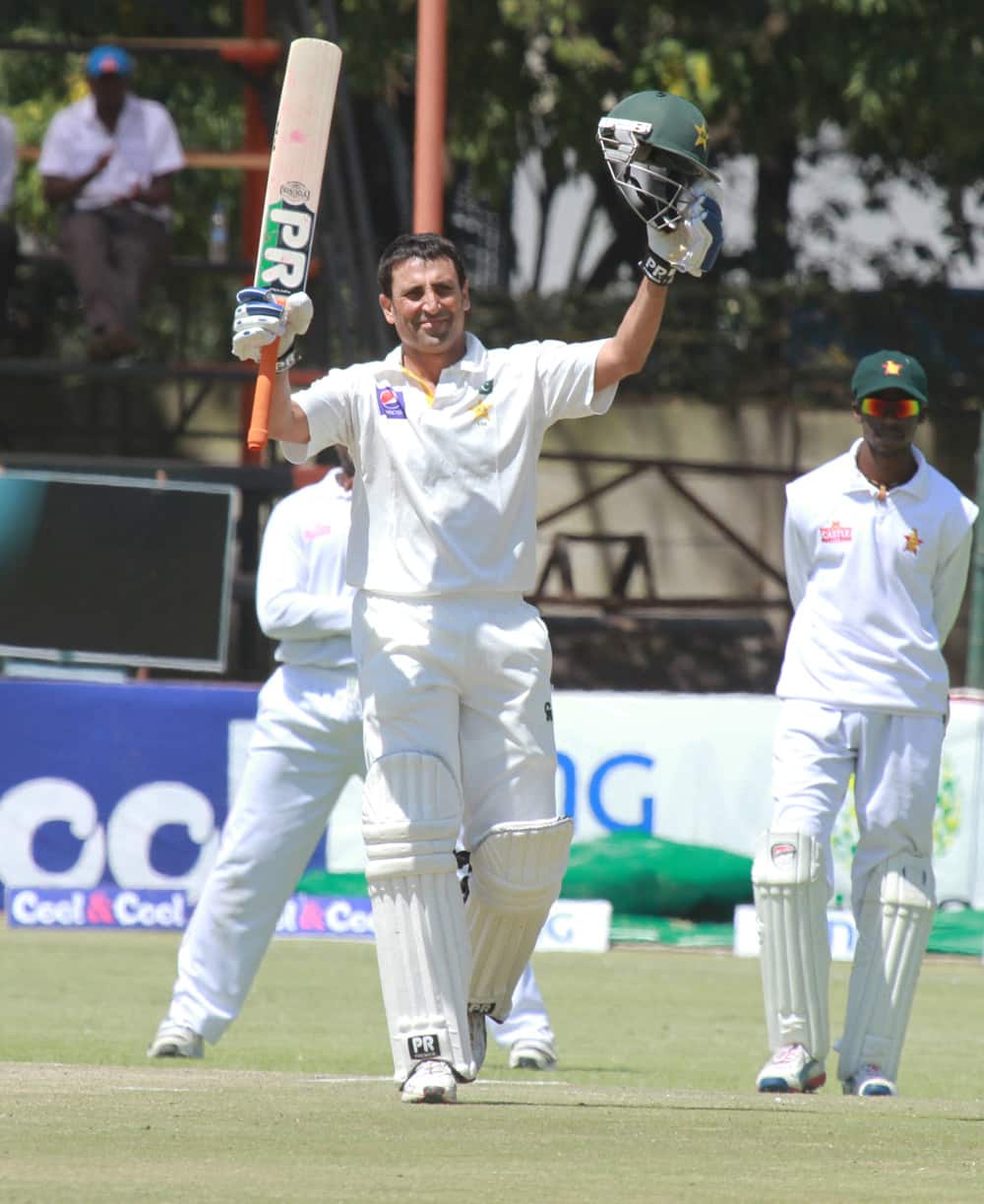 Pakistan batsman Younis Khan celebrates after scoring 100 runs on the fourth day of the first test match against Zimbabwe at Harare Sports Club in Harare.