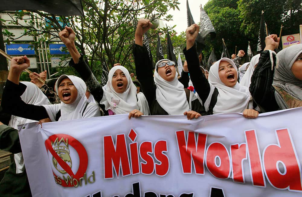 Muslim women chant slogans during a protest demanding the cancellation of the Miss World pageant that will be held in Bali and Sentul, West Java later this month, in Jakarta.