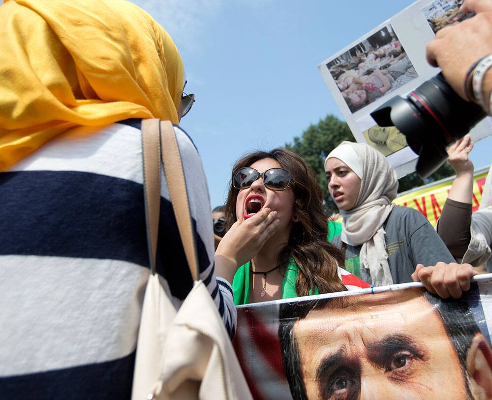 Asmaa Al-Ghafari, center, a self-described