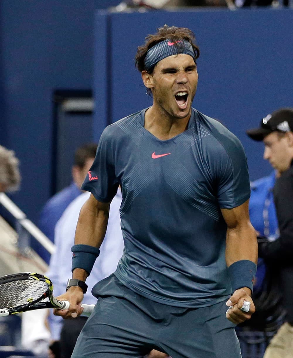 Rafael Nadal, of Spain, celebrates after defeating Tommy Robredo, of Spain, 6-0, 6-2, 6-2 in a quarterfinal of the US Open tennis tournament.