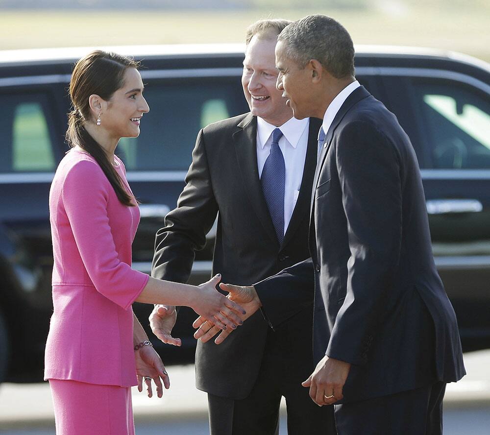 US President Barack Obama is greeted by US Ambassador Mark Brzezinski, and his wife Natalia Brzezinski upon his arrival at Stockholm-Arlanda International Airport, in Stockholm, Sweden.