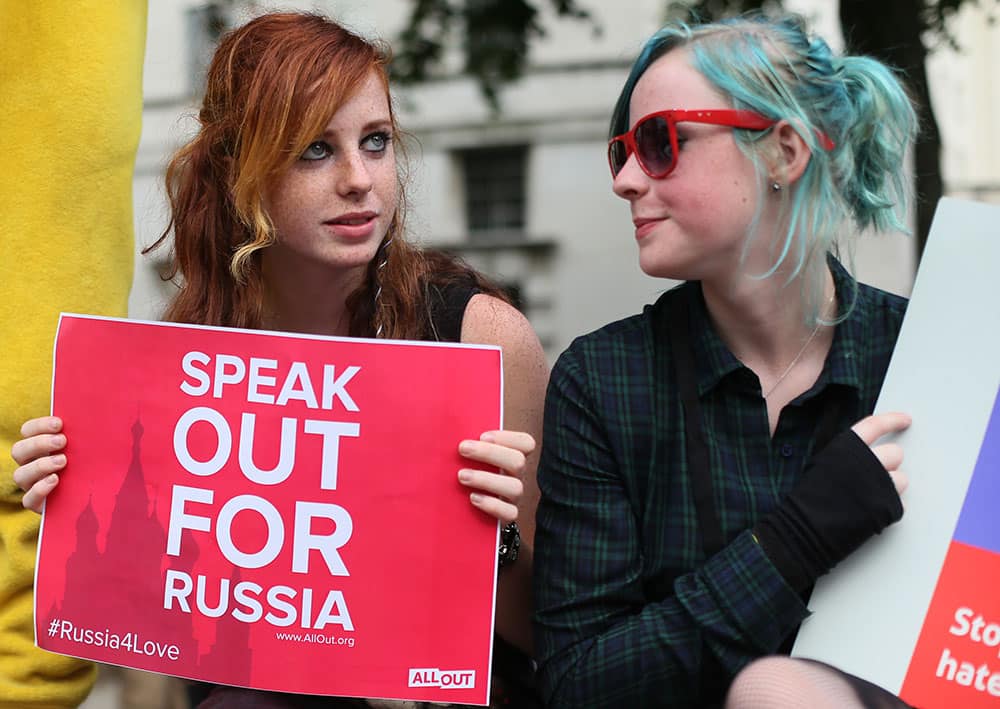 Protesters of the gay and lesbian activist group AllOut demonstrate opposite Downing Street, in central London about the treatment of LGBT people in Russia and a law adopted by Russia`s parliament in June making