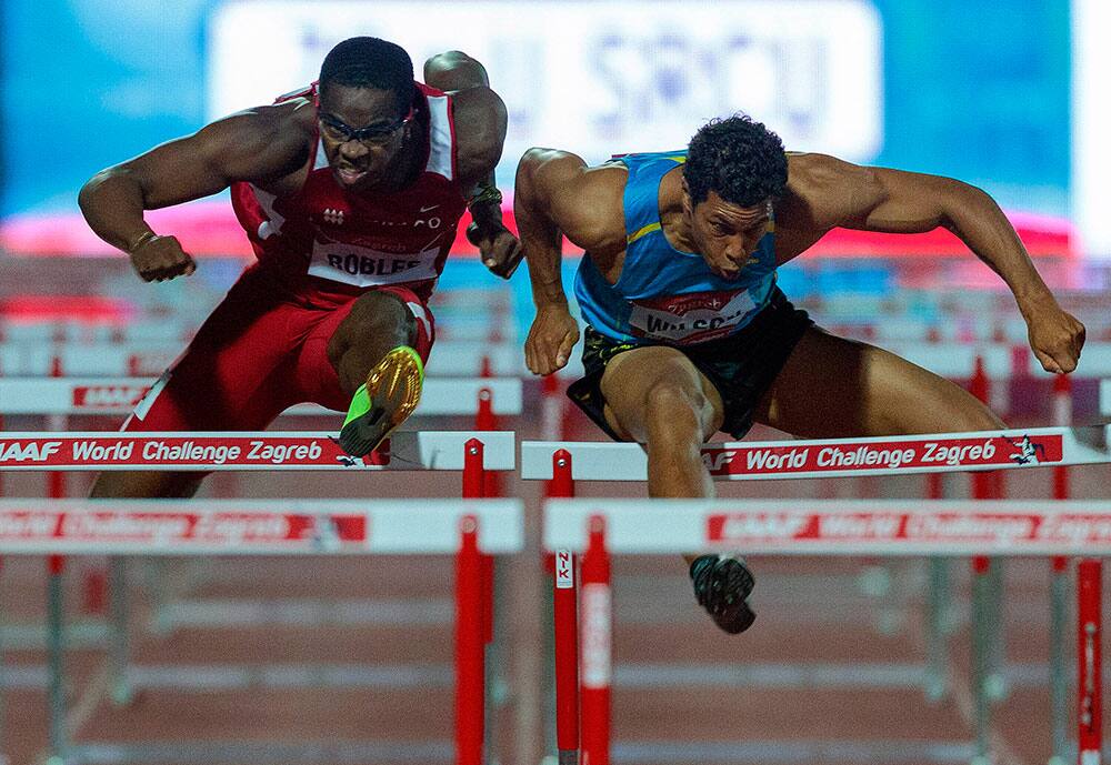 Ryan Wilson from the US, right and Dayron Robles from Cuba compete in the Men`s 110m hurdles at the IAAF World Challenge Zagreb meeting in Zagreb, Croatia.