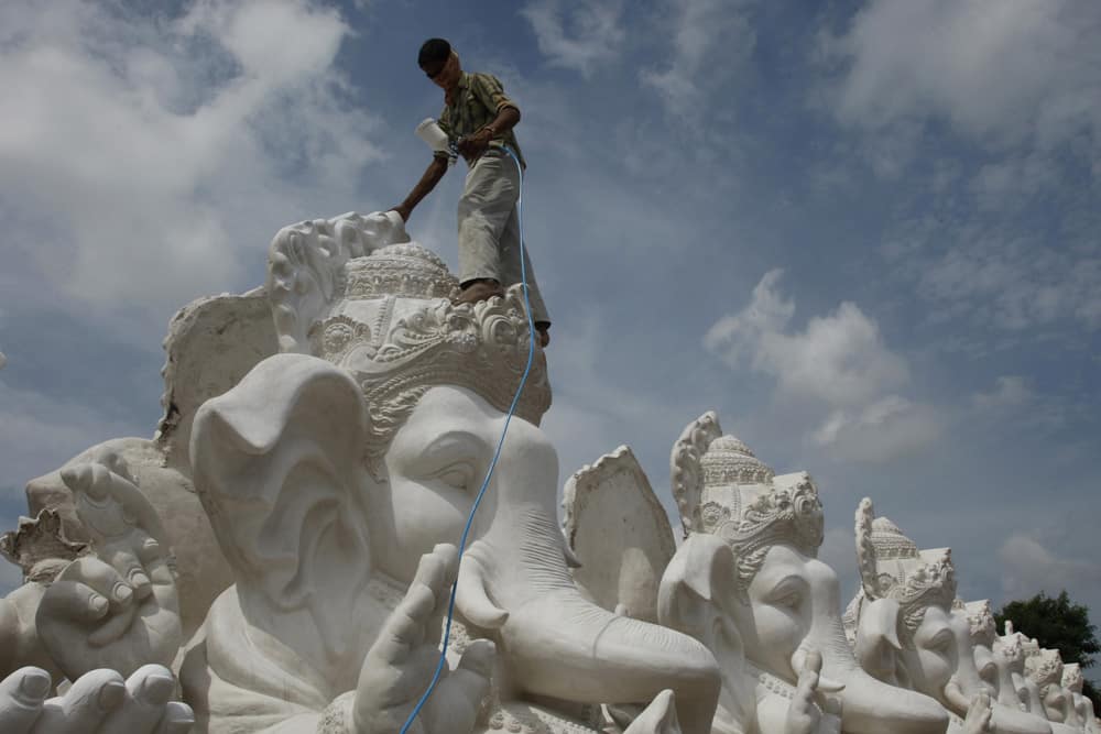 A artist prepares idols of Hindu god Ganesh ahead of Ganesh Chaturthi festival at a workshop in Hyderabad.