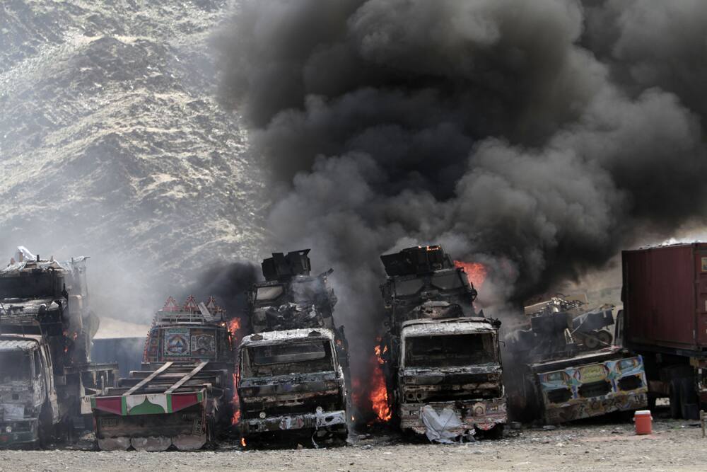Smoke rises from NATO supply trucks following an attack by militants in the Torkham area near the Pakistan--Afghanistan border in Jalalabad province east of Kabul, Afghanistan.