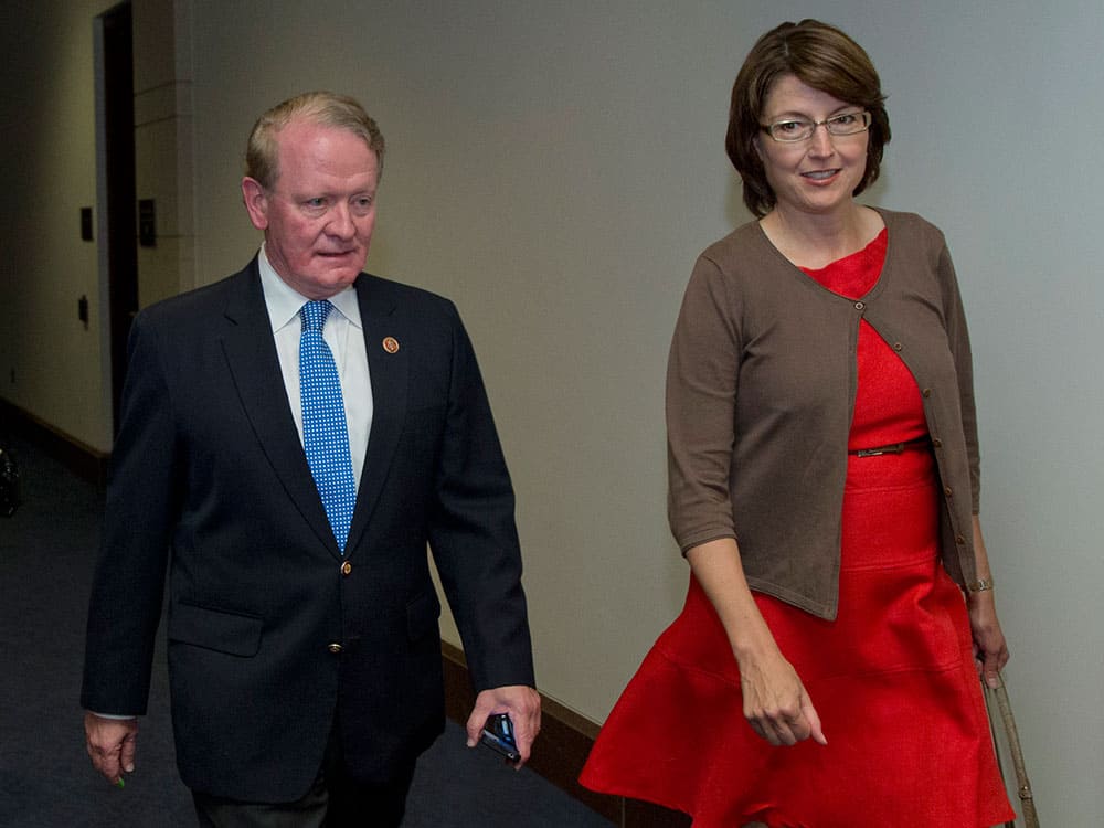Rep. Cathy McMorris-Rodgers, R-Wash., right, and Rep. Leonard Lance, R-N.J., head to a classified members-only briefing on Syria by senior administration officials on Capitol Hill.