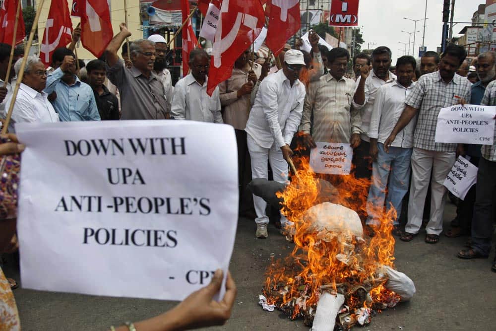 Activists of Communist Party of India Marxist (CPIM) burn an effigy representing United Progressive Alliance (UPA) government during a protest against fuel price hike in Hyderabad.