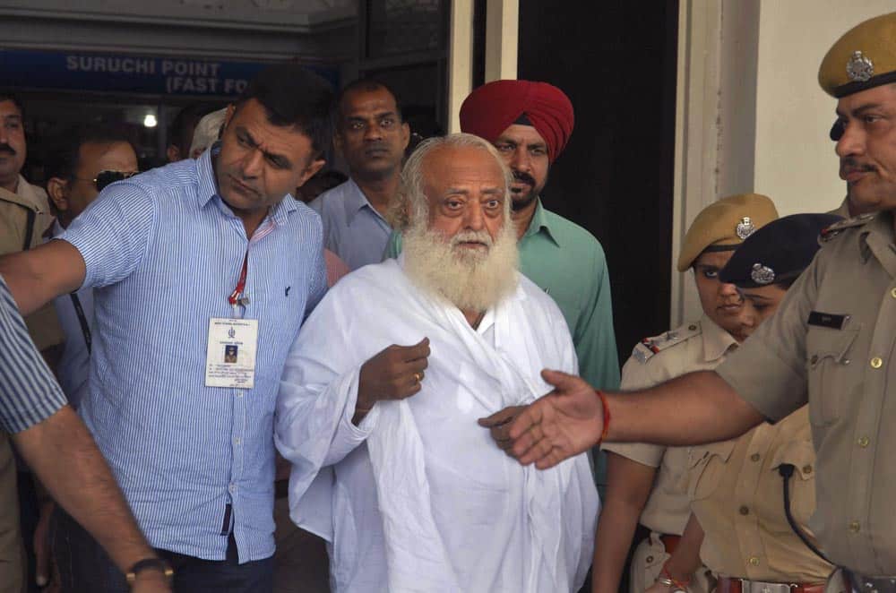 Controversial spiritual guru Asaram Bapu, is brought for interrogation by police at Jodhpur airport in Jodhpur. Bapu was arrested early Sunday on a rape charge filed by a teen-age girl in the northwestern Indian state of Rajasthan, police said.