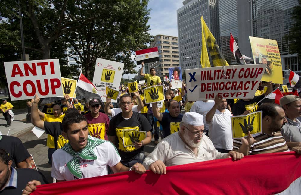 A crowd rallying against the military coup in Egypt marches up Pennsylvania Avenue in Washington.