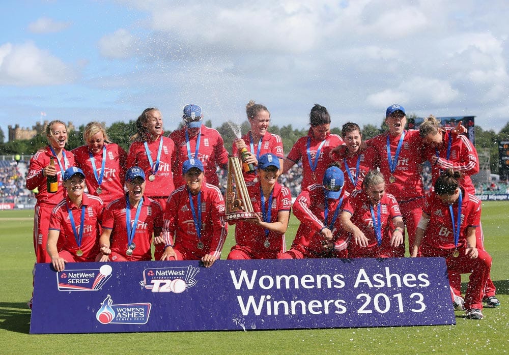 The England`s squad celebrate with the trophy after winning the women`s Ashes, at the end of their Twenty20 cricket match against Australia, at the Riverside cricket ground, Chester-le-Street, England.