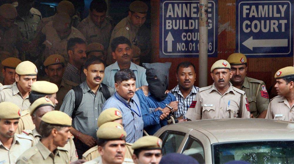 Yasin Bhatkal, face covered, one of the leaders of the domestic terror group Indian Mujahideen is seen at a court in New Delhi.
