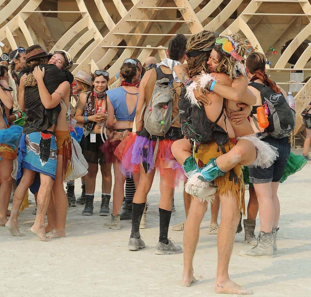 People gather outside a temple art structure at Burning Man in Gerlach, Nev. Once a year, tens of thousands of participants gather for Burning Man in Nevada`s Black Rock Desert to create Black Rock City, dedicated to community, art, self-expression and self-reliance.