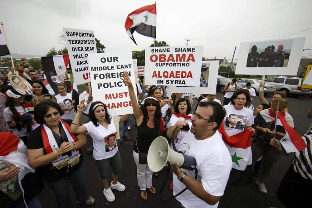 Members of the local Syrian community march in protest against the United States` involvement in Syria.
