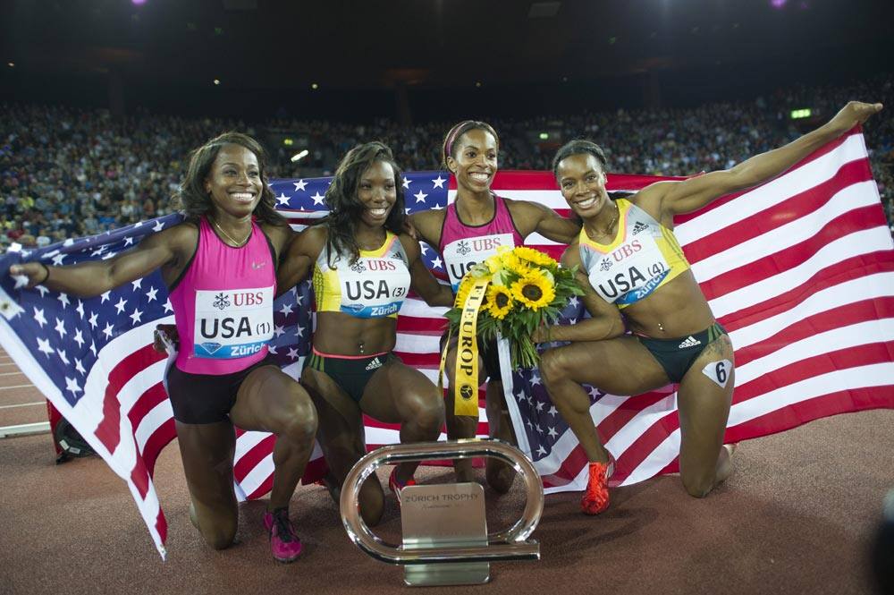 USA relay team with Barabara Pierre, Tiffany Townsend, Alexandra Anderson, and Charonda Williams, from left to right, react after the women`s 4x100m relay race
