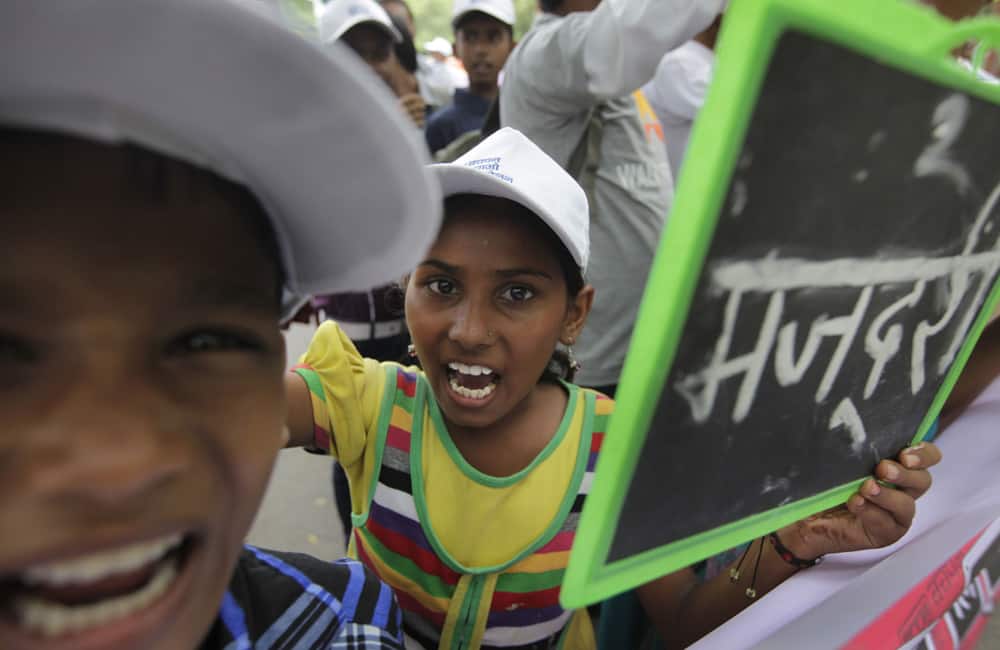 Children and freed child laborers participate in a march demanding the passage of the Child and Adolescent Labor (Protection and Regulation) Bill, in New Delhi.