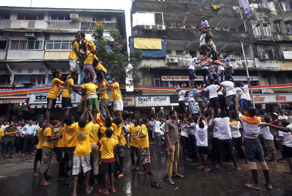 Devotees attempt to break the