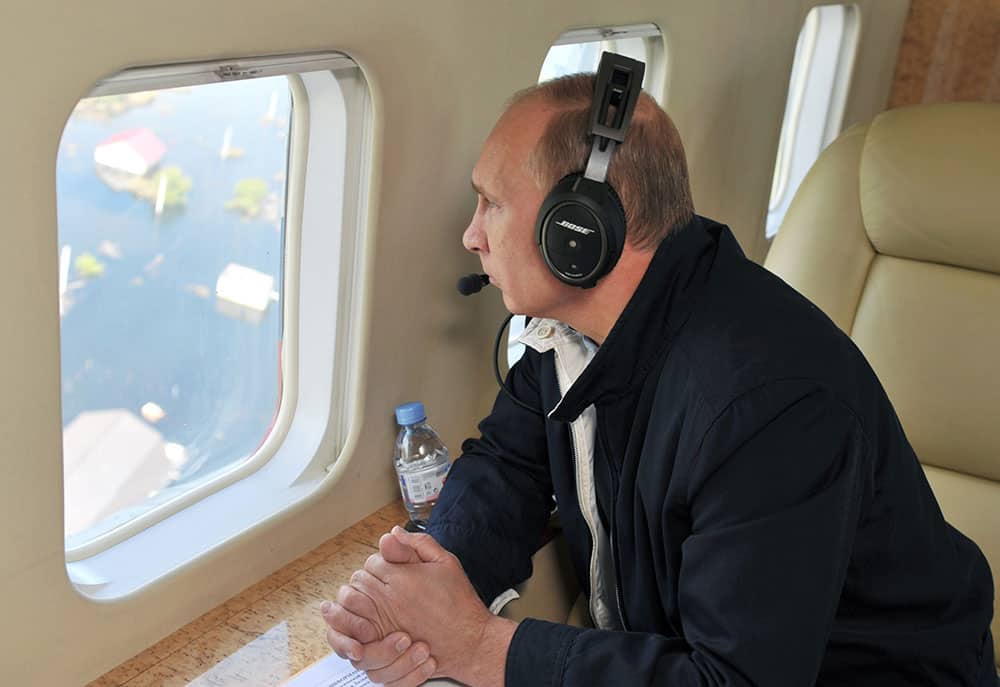 Russian President Vladimir Putin inspects flooded areas on board a helicopter in the Amur region. The worst flooding in 120 years in Russia`s Far East has already forced about 20,000 people from their homes, the Emergency Situations Ministry said.