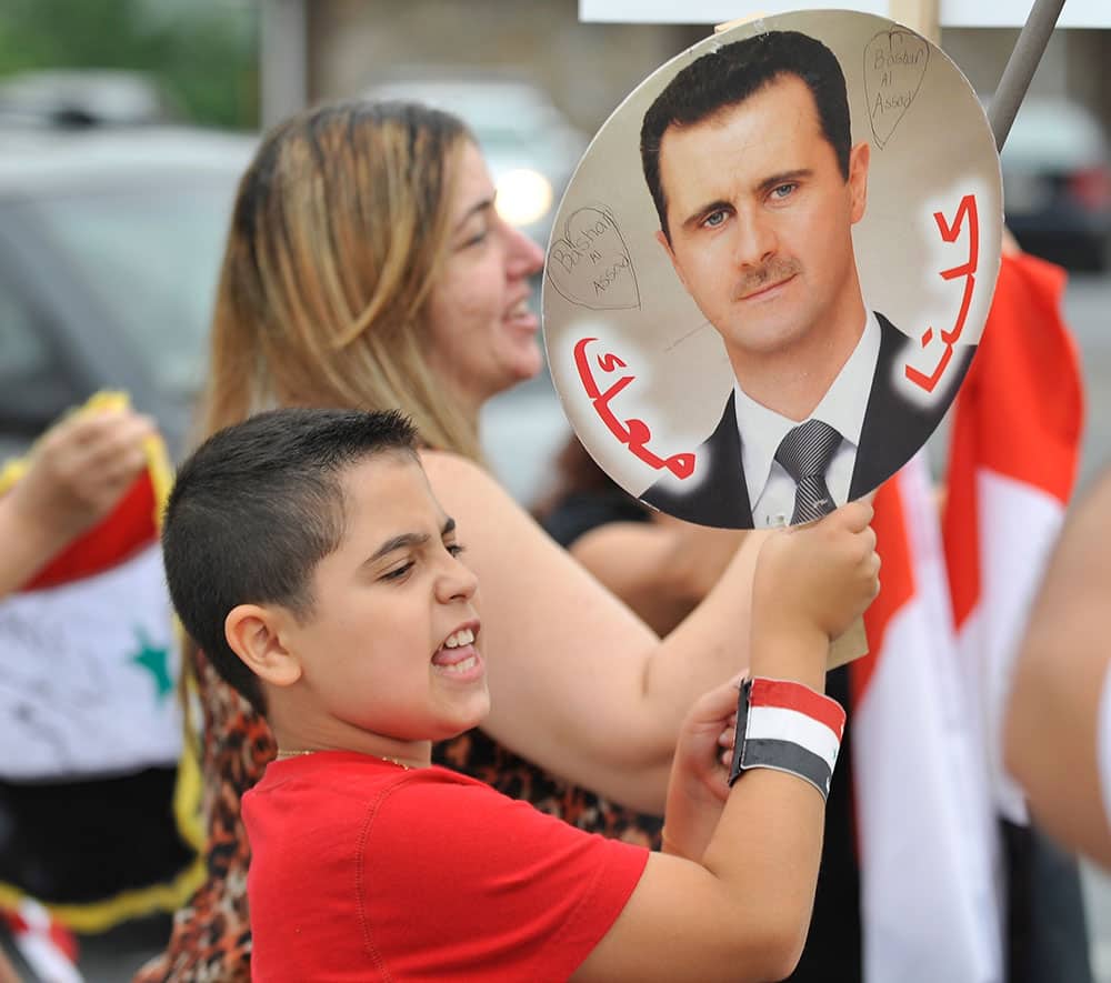 Members of the local Syrian community rally for the second day in a row against the United States` involvement in Syria, in Allentown, Pa.