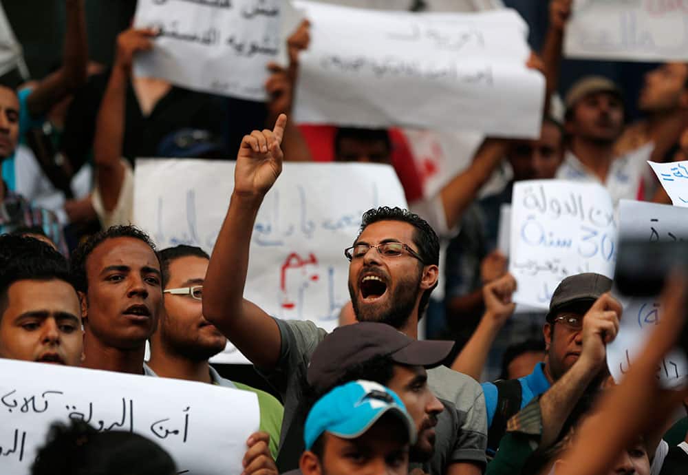 Demonstrators chant slogans during a protest against ousted President Hosni Mubarak’s release from prison, in Cairo, Egypt.