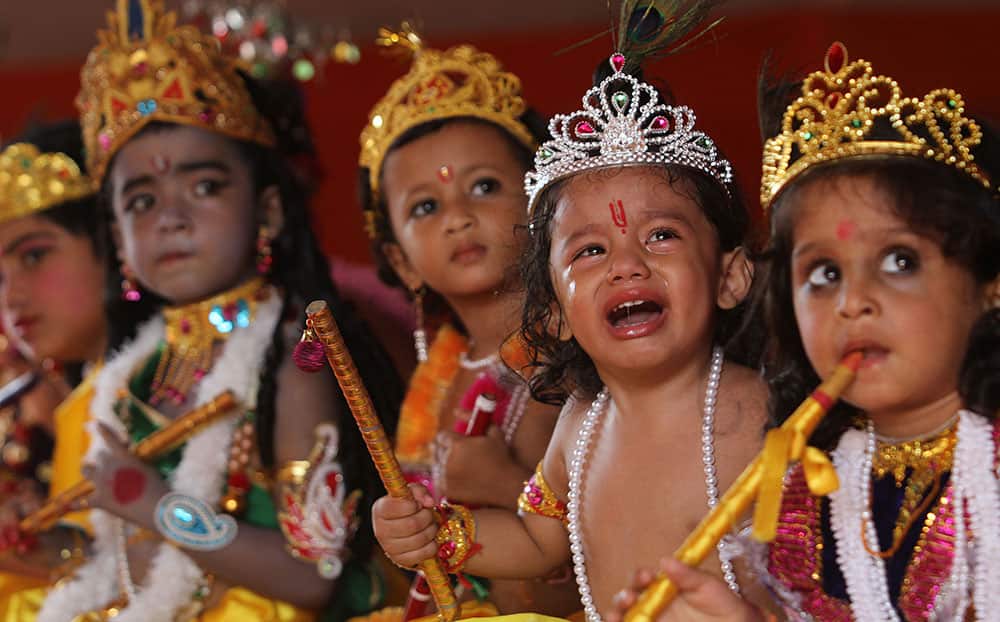 Children dressed as Hindu God Krishna participate in a function during the Janmashtami festival celebrations in Gauhati, India.