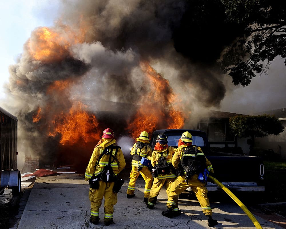 Fairfield, Calif. firefighters attack a the fully involved garage of a home in the 2900 block of Marigold Dr. in Fairfield.