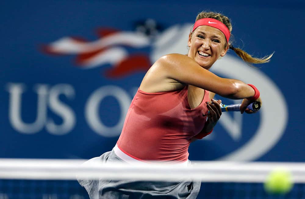 Belarus`s Victoria Azarenka returns a shot to Germany`s Dinah Pfizenmaier during the first round of the US Open tennis tournament.