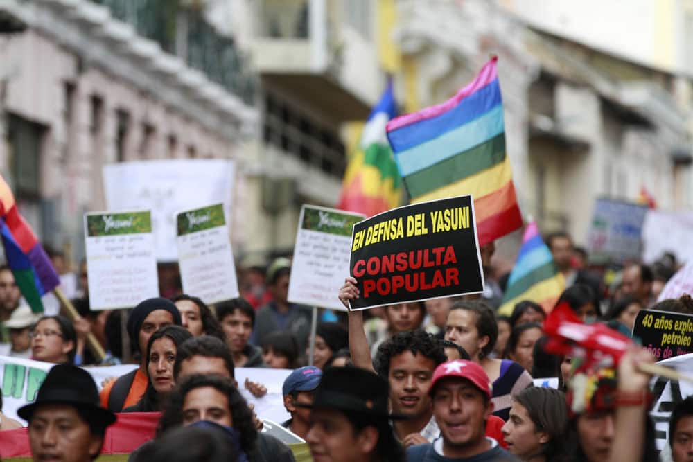People demonstrate against the government`s decision to allow oil drilling in the Yasuni National Park, a rainforest amazon preserve, in Quito, Ecuador.