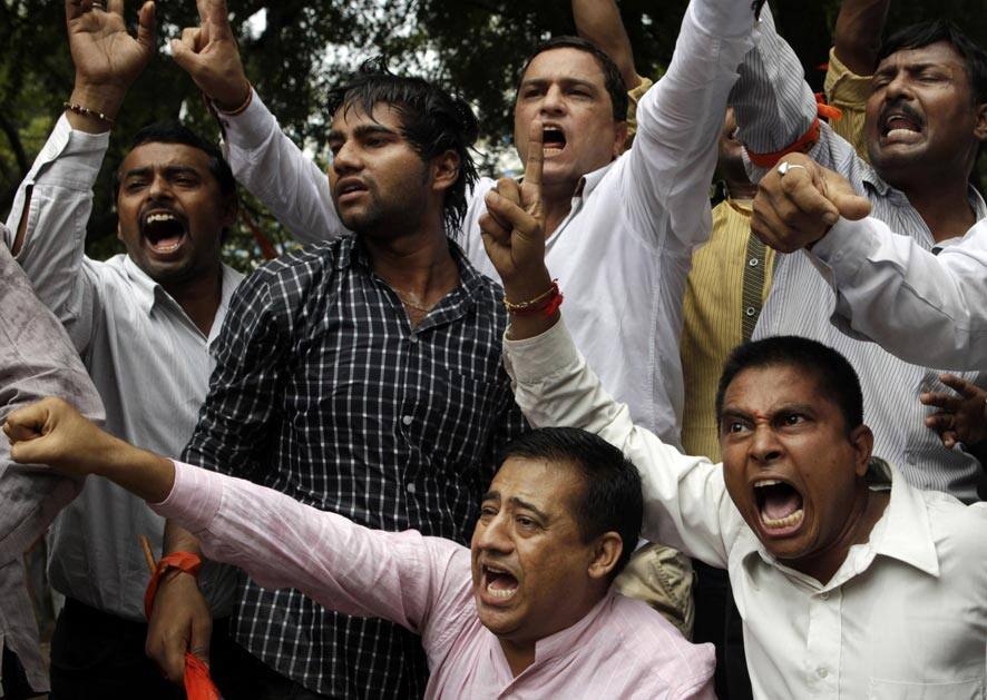 Supporters of World Hindu Council or Vishwa Hindu Parishad (VHP) shout slogans during a protest in New Delhi.