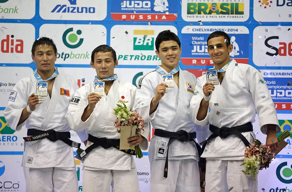 Medal winners from the -60kg category at the World Judo Championships, from left to right, silver medal winner Amartuvshin Dashdavaa of Mongolia, gold medal winner Naohisa Takato of Japan, and bronze medal winners Won Jin Kim from South Korea and Orkhan Safarov of Azerbaijan pose on the winners podium in Rio de Janeiro.