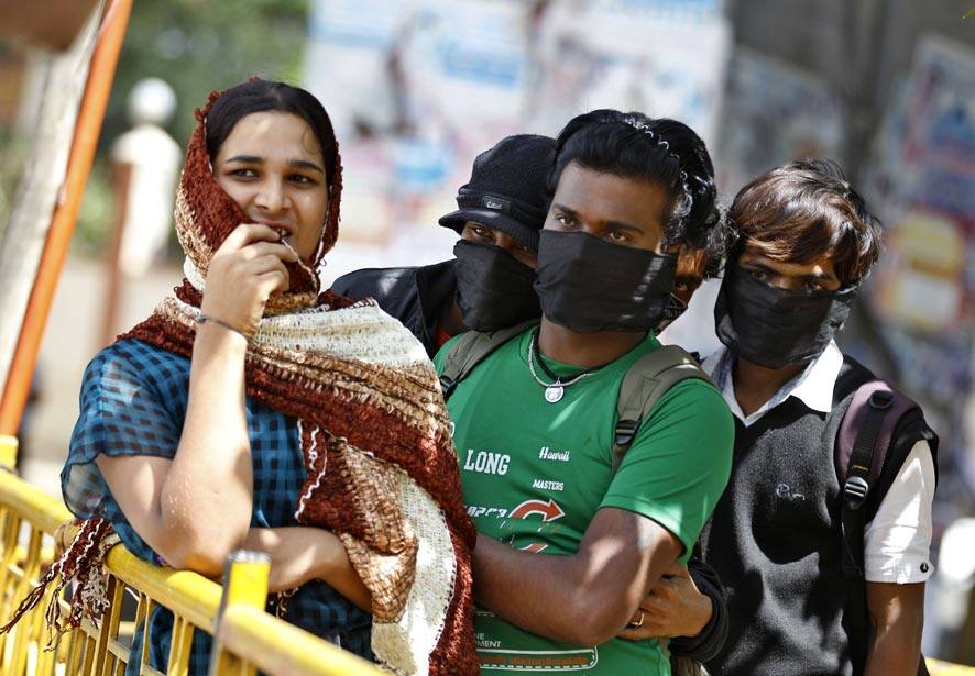 Members of Ashodaya Samithi, an organization for homosexual and transgender sex workers, listen to a speaker during a protest in Bangalore.