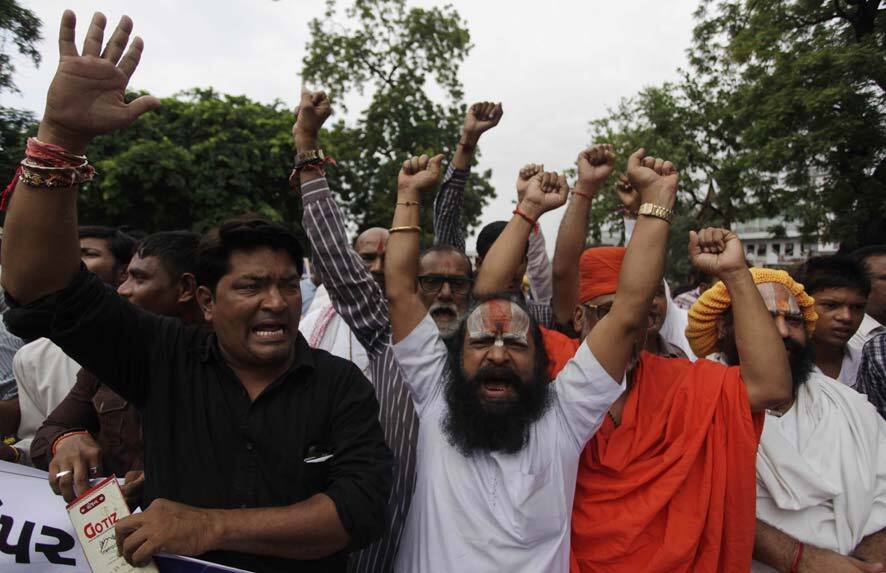 Indian supporters of Vishwa Hindu Parishad( VHP) or World Hindu Council shout slogans as they protest in Ahmedabad.