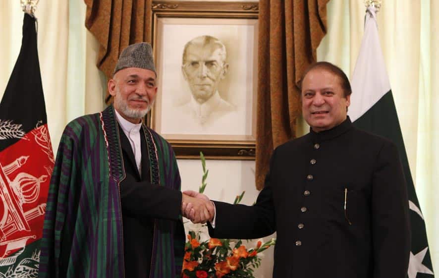 Afghan President Hamid Karzai, left, shakes hand with Pakistani Prime Minister Nawaz Sharif prior to their meeting in Islamabad, Pakistan.
