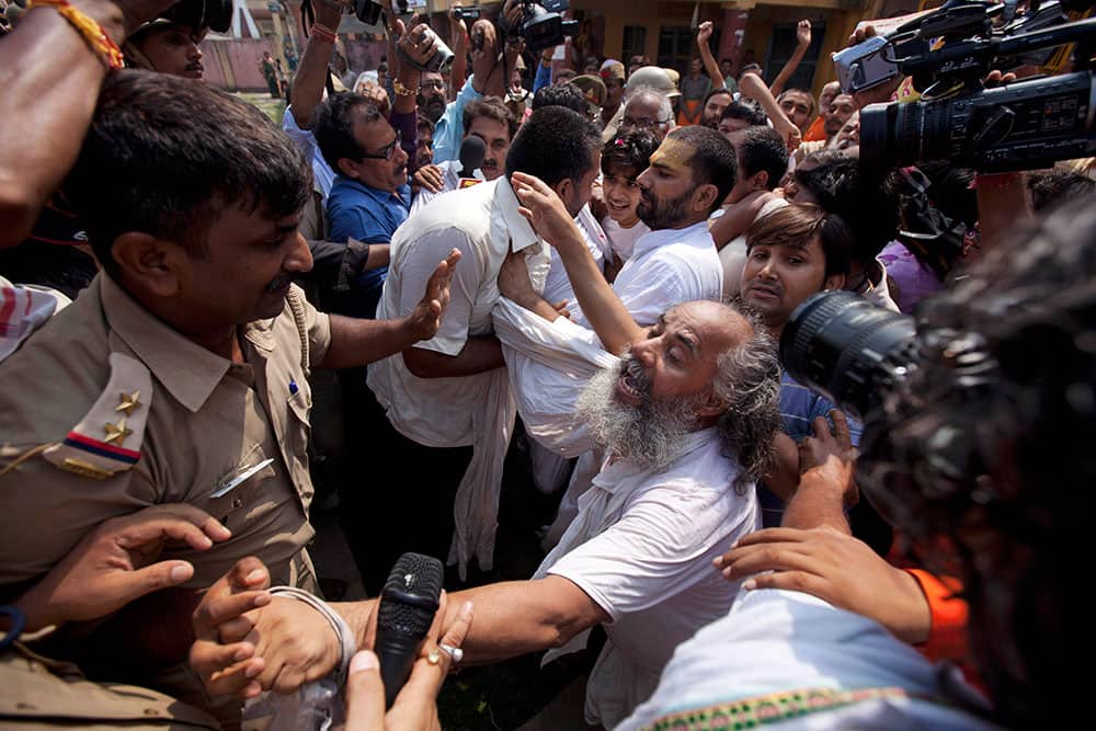 Policemen stop activists of the nationalist organization Vishva Hindu Parishad (VHP) or World Hindu Council in Ayodhya.