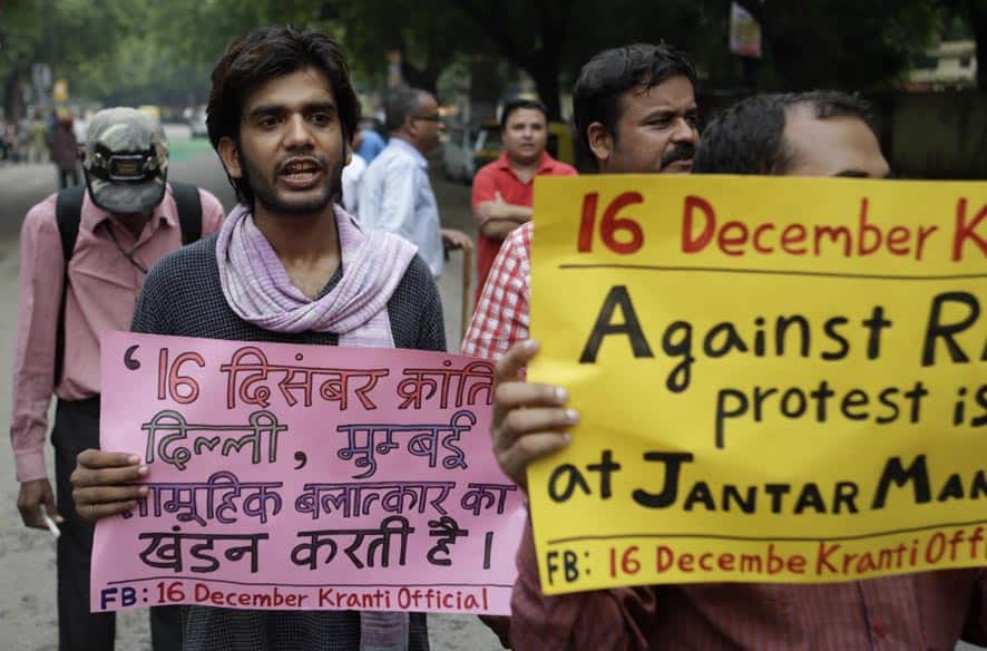 Men hold placards during a protest against rape in New Delhi. Police on Sunday arrested the last of five men wanted in the gang rape of a 22-year-old woman in Mumbai, and said charges would be filed soon in a case that has incensed the public and fueled debate over whether women can be safe in India.