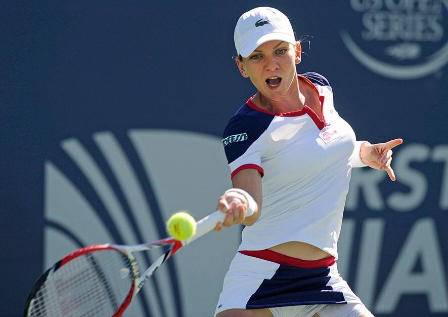 Simona Halep, of Romania, hits a forehand during her 6-2, 6-2 victory over Petra Kvitova, of the Czech Republic, in the final of the New Haven Open tennis tournament in New Haven, Conn.