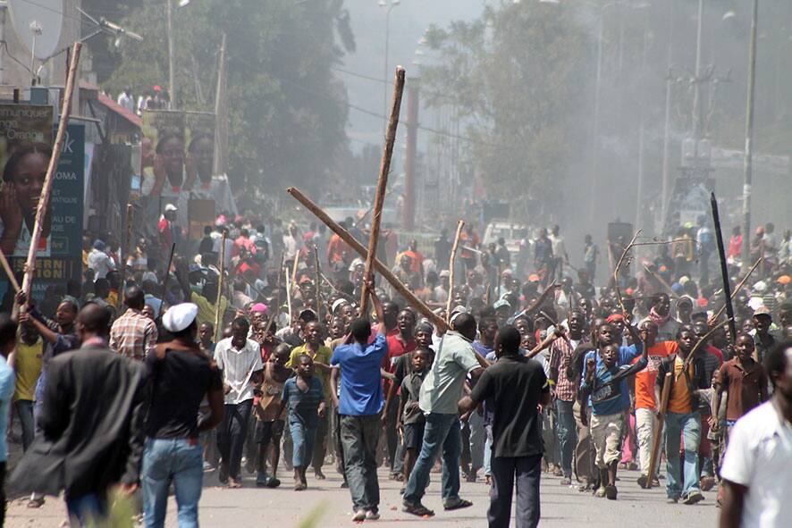 Angry residents take to the streets in protest over recent violence, including deadly shelling hours earlier, in Goma, Congo.