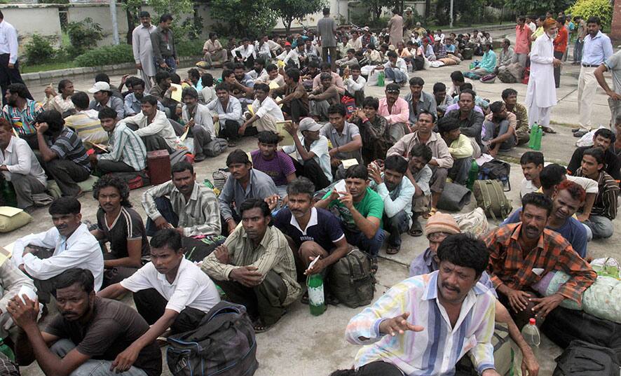 Released Indian fishermen wait to cross over to the Indian side of the border at the India-Pakistan border post of Wagah, Pakistan.