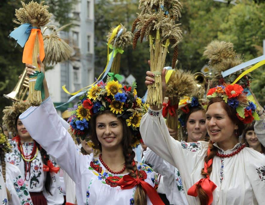 People dressed in Ukrainian folk costumes march during a parade to celebrate Ukraine`s Independence Day in Kiev, Ukraine.
