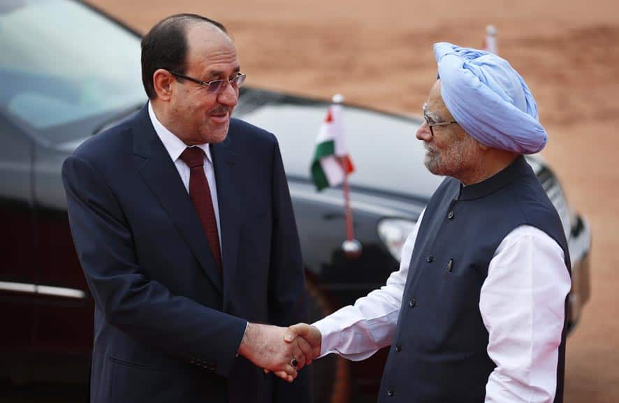 Iraqi Prime Minister Nouri al-Maliki, is greeted by Indian Prime Minister Manmohan Singh during his ceremonial reception at the Presidential Palace grounds in New Delhi.