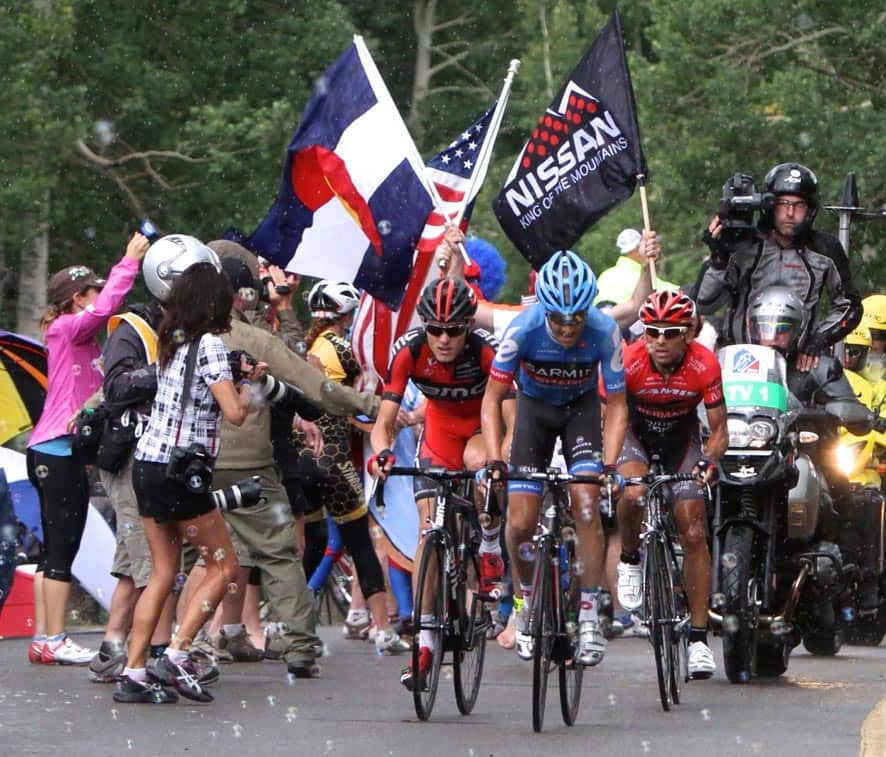 Tom Danielson, center, of the United States, holds a small lead in front of Tejay Von Garderen, of the United States, and Janier Acevedo, of Colombia, as the leaders rush toward the King of the Mountain finish at the top of Bachelor Gulch before making their descent and final climb toward the Beaver Creek, Colo.