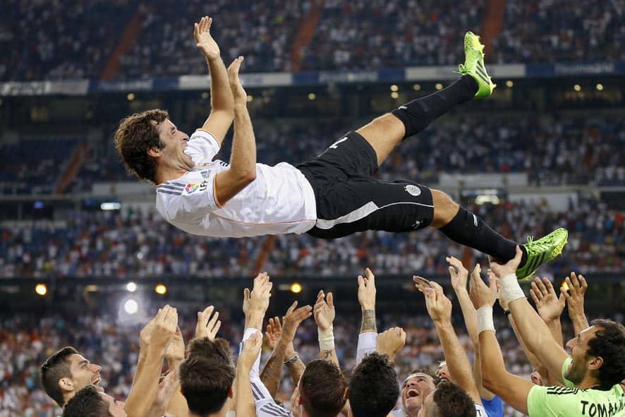 Real Madrid`s Raul Gonzalez Blanco is thrown in the air after the Santiago Bernabeu trophy soccer match between Real Madrid and Al Sadd at the Santiago Bernabeu stadium, in Madrid.