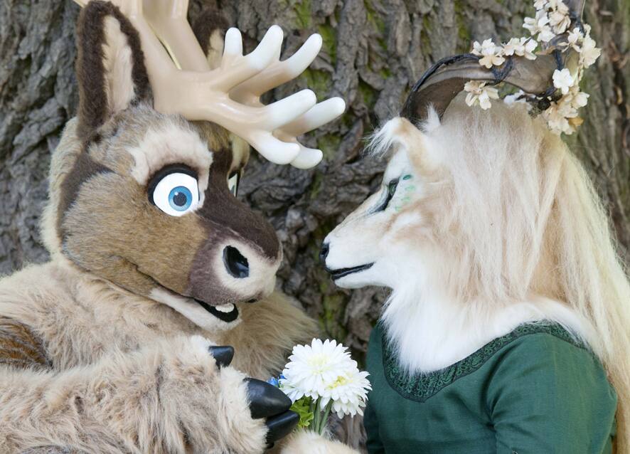 People dressed in fanciful animal costumes pose in the Magdeburg zoo during the opening of the Eurofurence Convention in Magdeburg, central Germany.
