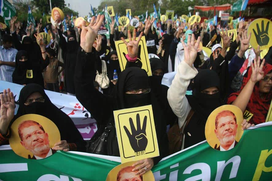 Supporters of Pakistani religious party Jamaat-i-Islami rally in Karachi, Pakistan to show their support for ousted Egyptian President Mohammad Morsi.