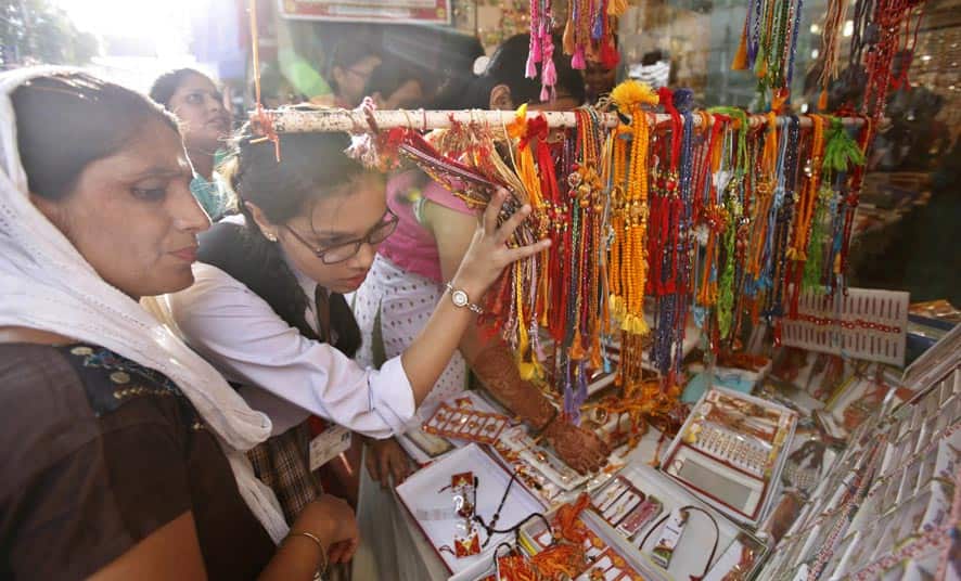 Indian girls shop for `Rakhis`, a sacred thread tied on the wrists of brothers on Raksha Bandhan festival in Varanasi.