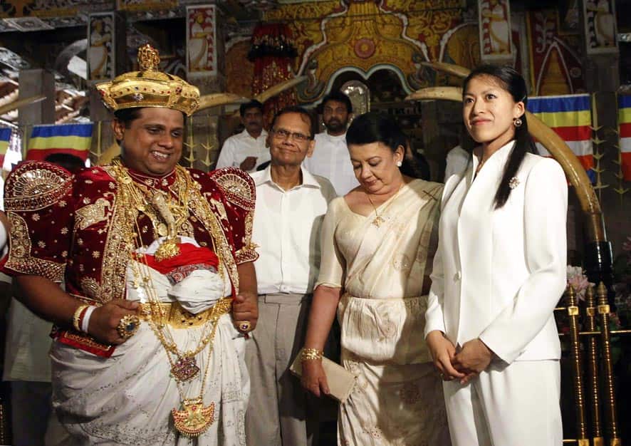 Shiranthi Rajapaksa, wife of Sri Lankan President Mahinda Rajapaksa and Nilanga Dela, chief custodian of the Temple of Tooth, escort Japanese Princes Tsuguko, right, in Kandy, Sri Lanka.