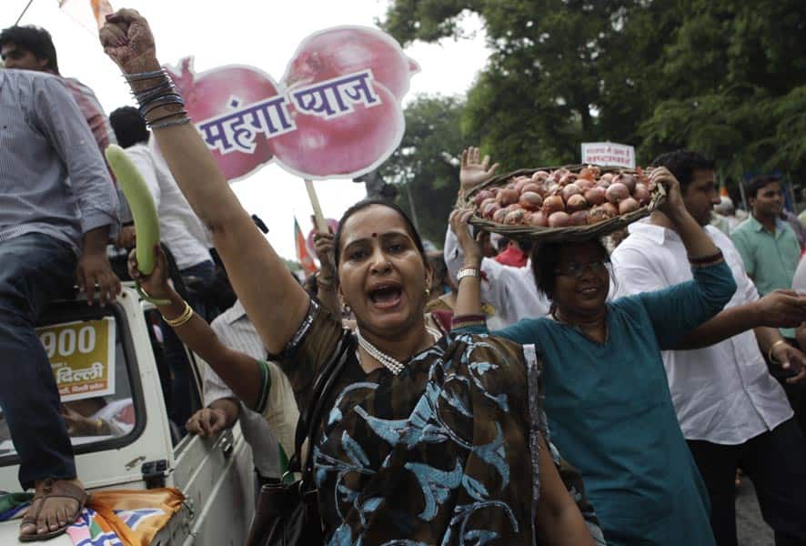 Bharatiya Janata Party (BJP) activists hold baskets of onions during a protest against the price rise of food items in New Delhi.
