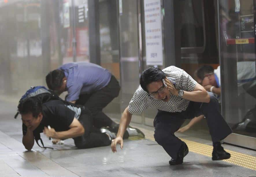 South Korean citizens take shelter from a mock gas attack during a South Korea-US joint military exercise,